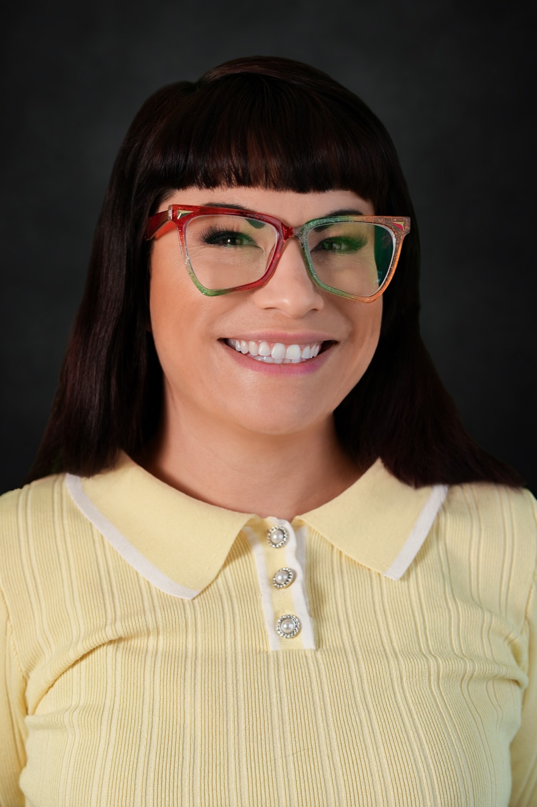 Tia, Las Vegas actress headshot with bold glasses